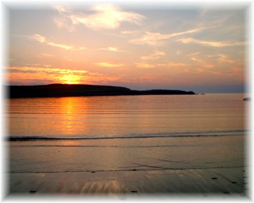 Sunset over water and shoreline